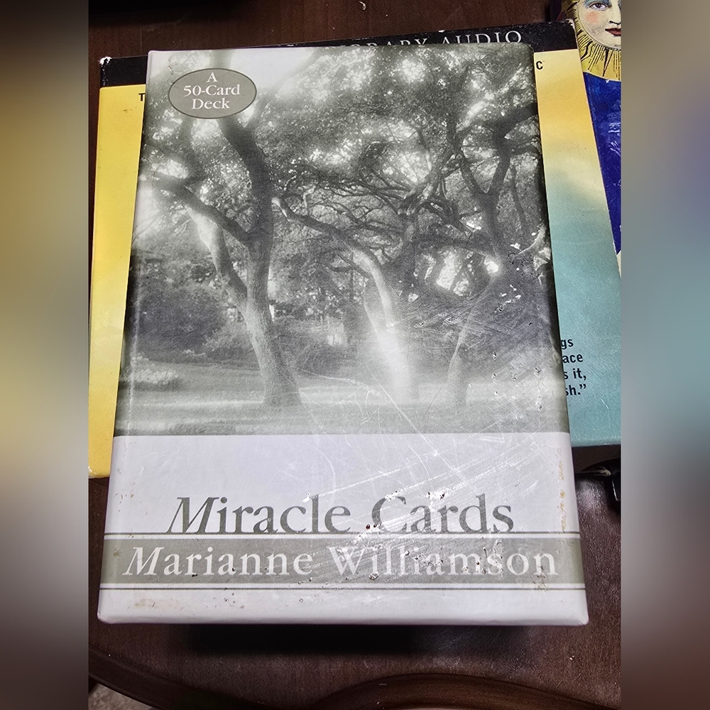 Miracle Cards" by Marianne Williamson. It is a 50-card deck of oracle cards. 